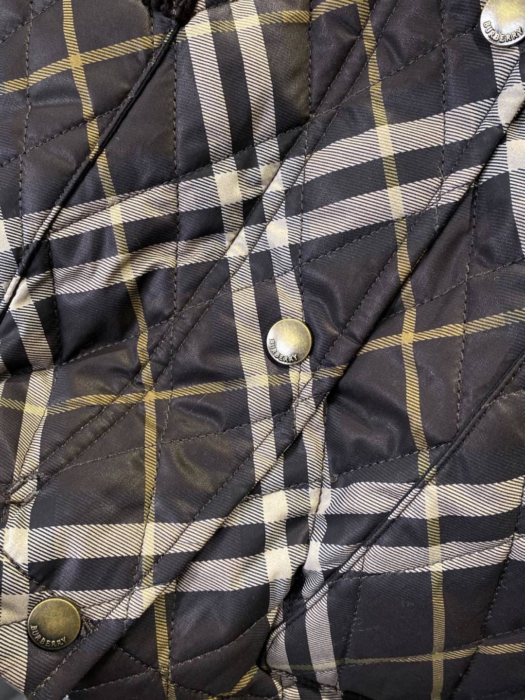 Burberry plaid puffer jacket with metal snap buttons and quilted check pattern