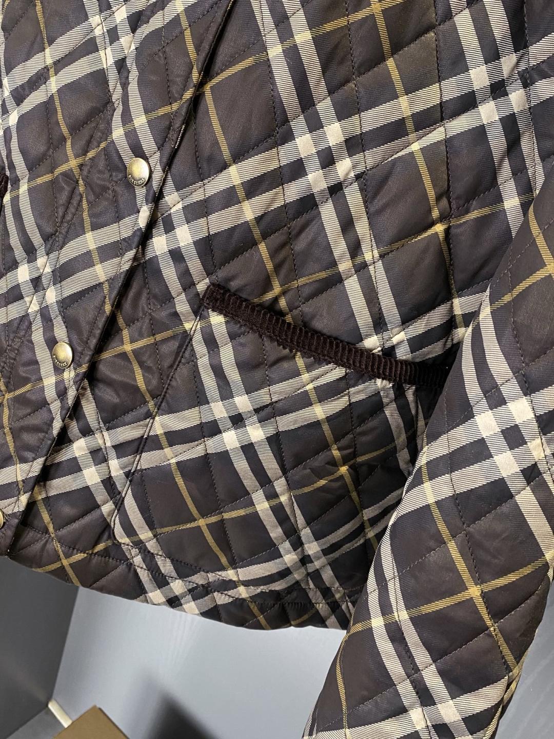 Burberry quilted plaid jacket with front button placket and dark pocket flaps