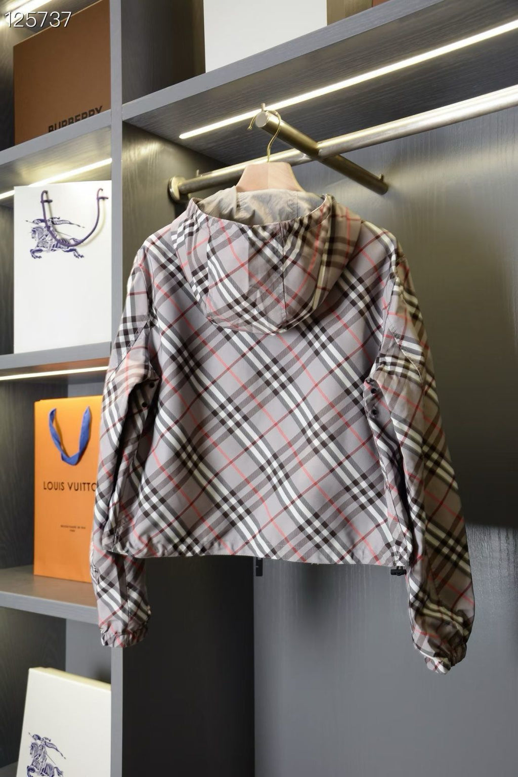 Plaid hooded jacket with front zipper and back horse logo patch