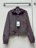 Burberry hooded plaid jacket in dark purple with zip front and elastic cuffs.