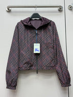 Burberry hooded plaid jacket in dark purple with zip front and elastic cuffs.
