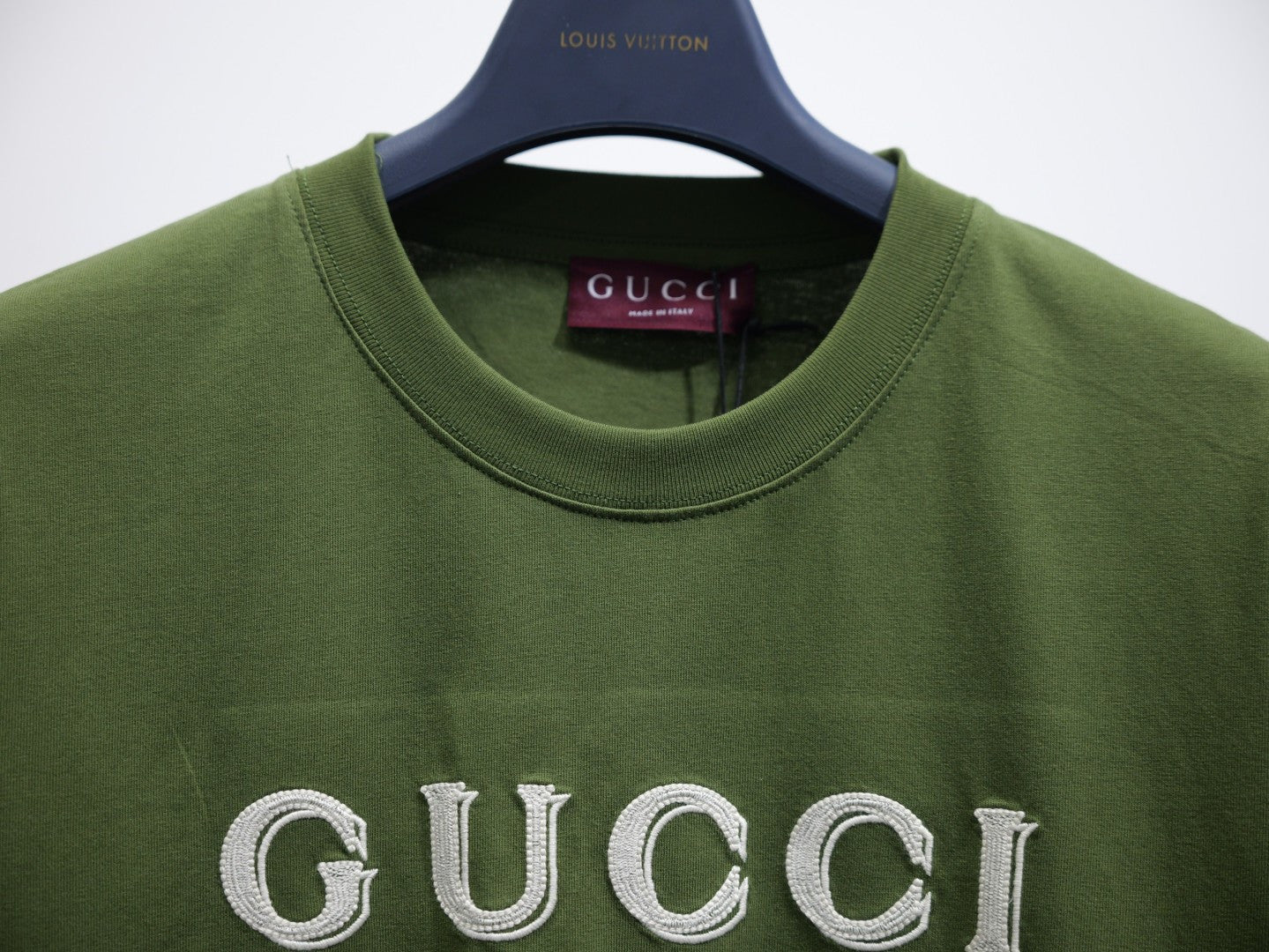 Olive green crew-neck T-shirt collar with Gucci label