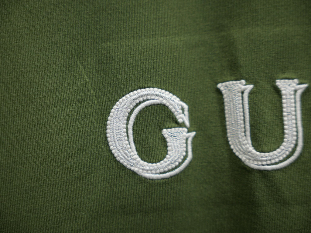 Olive green T-shirt with white Gucci embroidery detail