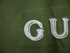 Olive green T-shirt with white Gucci embroidery detail