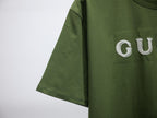 Olive green T-shirt with short sleeves and partial white Gucci print