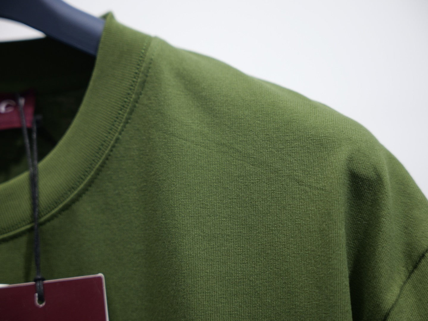 Olive green T-shirt back neckline and shoulder seam