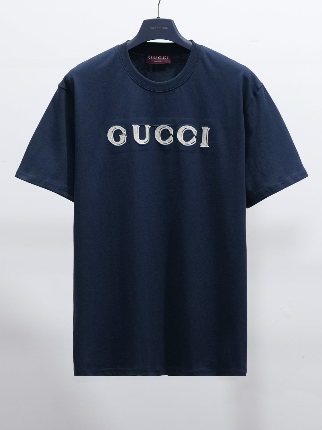 Short-sleeve T-shirt in dark navy with GUCCI logo across the chest