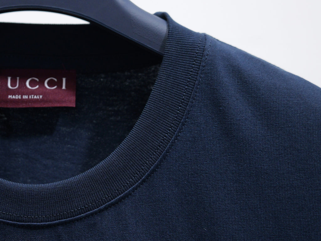 Dark navy short-sleeve T-shirt collar detail with ribbed neckline