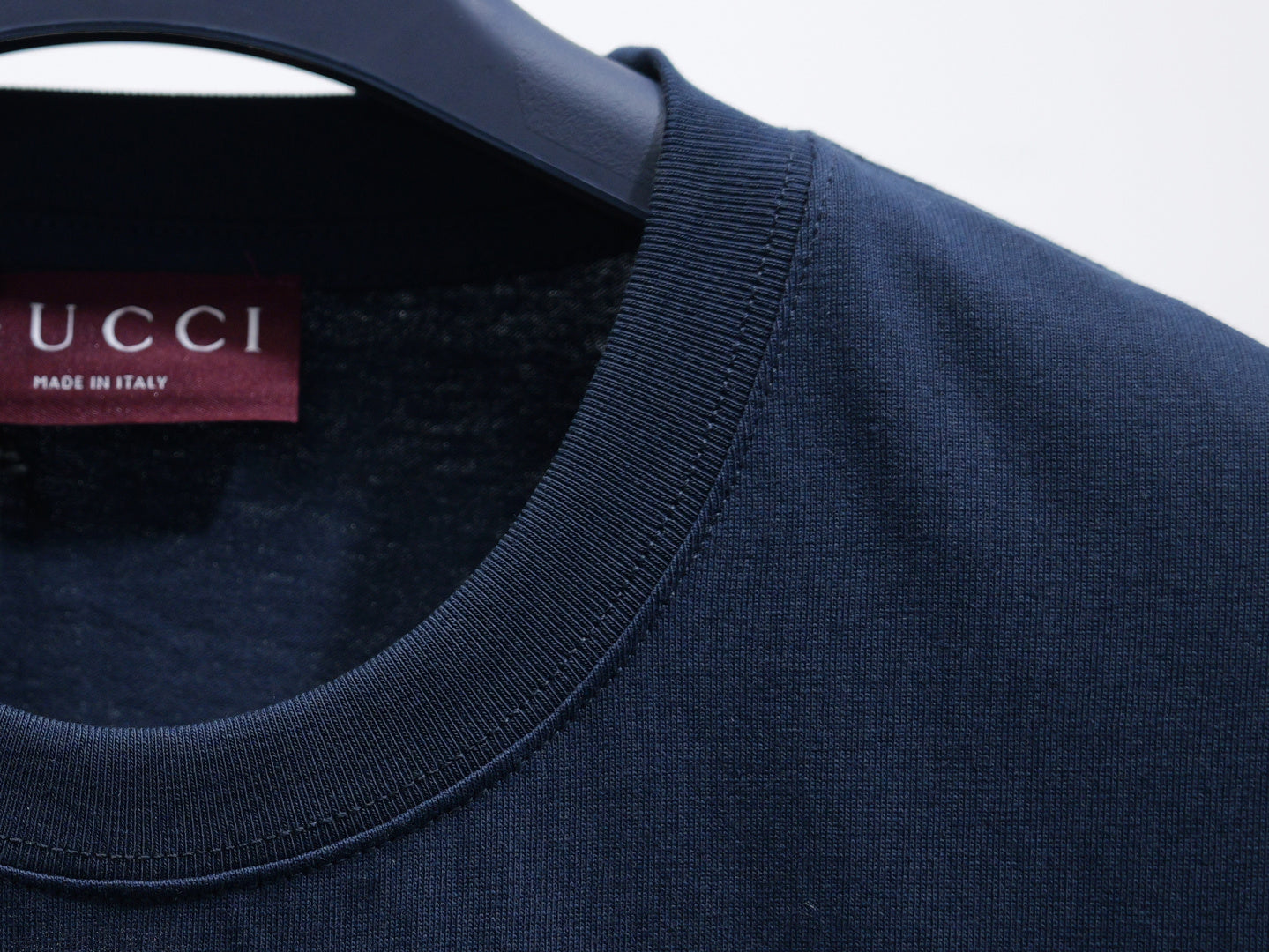 Dark navy short-sleeve T-shirt collar detail with ribbed neckline