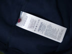 Interior care label on a dark navy short-sleeve T-shirt