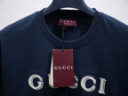 Dark navy short-sleeve T-shirt with GUCCI logo and hanging brand tag