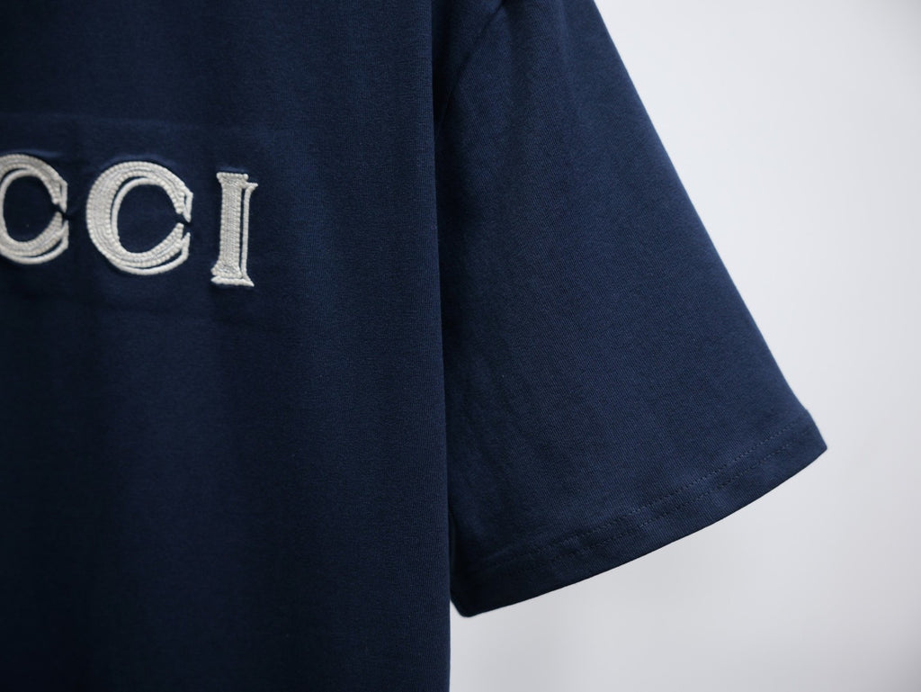 Dark navy short-sleeve T-shirt side view with visible sleeve and hem