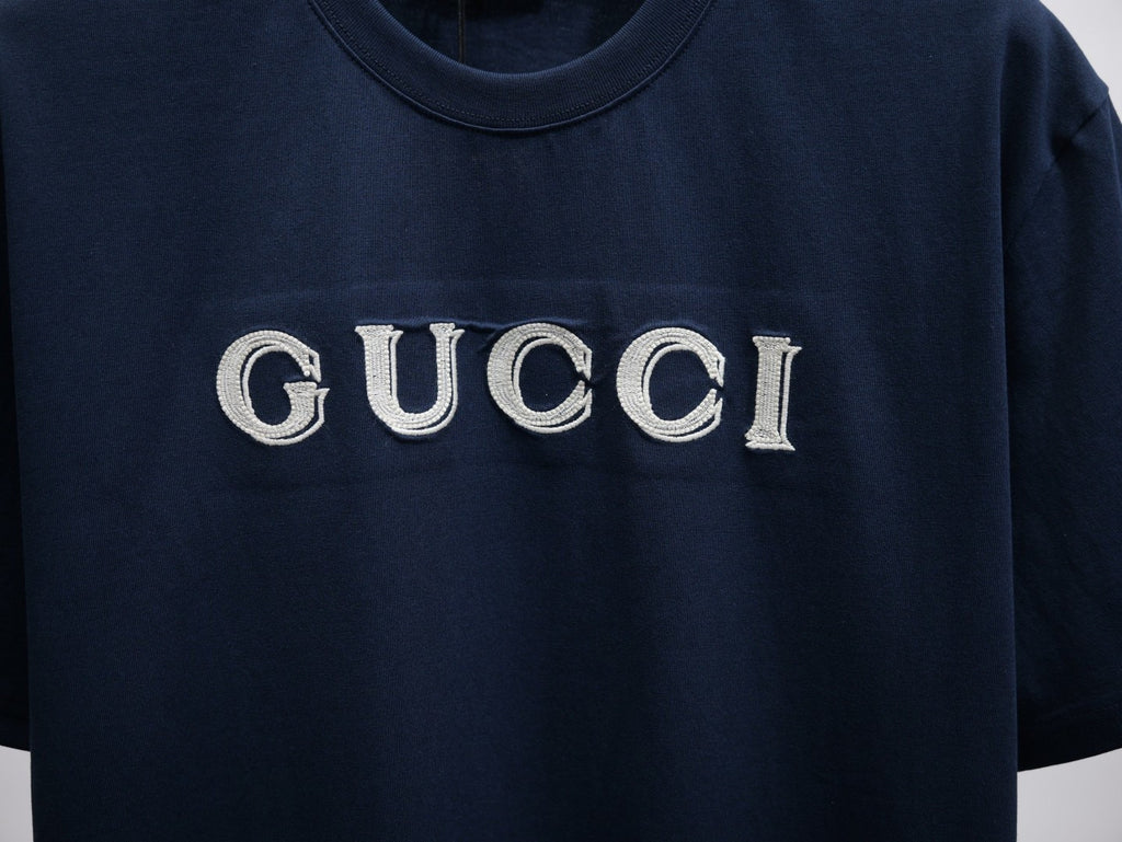 Dark navy short-sleeve T-shirt with large GUCCI logo on the chest