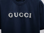 Dark navy short-sleeve T-shirt with large GUCCI logo on the chest