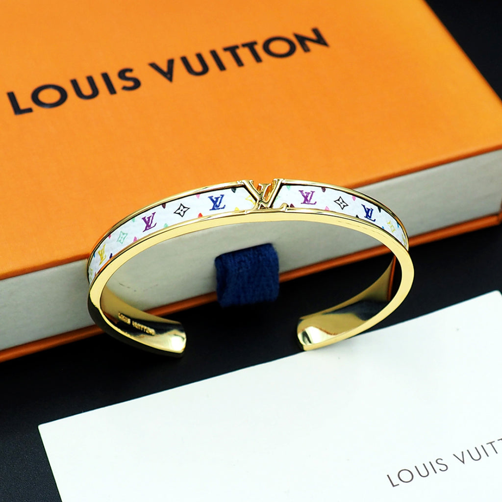 Louis Vuitton monogram cuff bracelet with gold-tone edges and colorful logo print