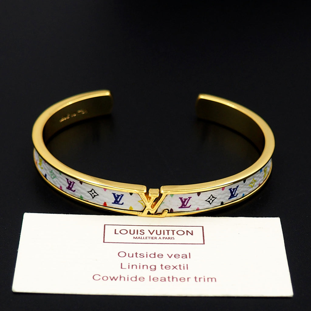 Louis Vuitton cuff bracelet with gold-tone trim and blue monogram pattern