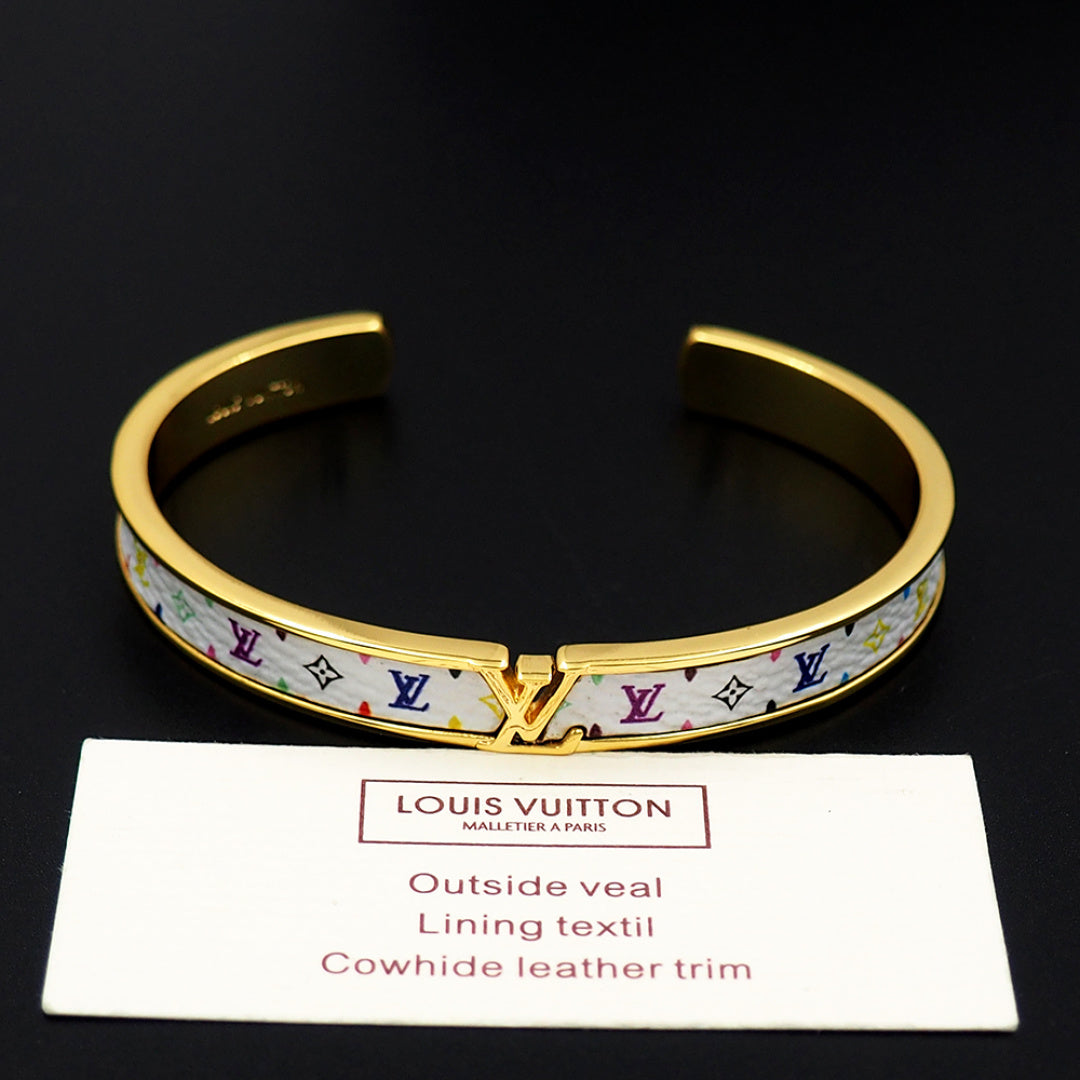 Louis Vuitton cuff bracelet with gold-tone trim and blue monogram pattern