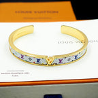 Louis Vuitton monogram cuff bracelet with gold-tone interior and multicolor LV band