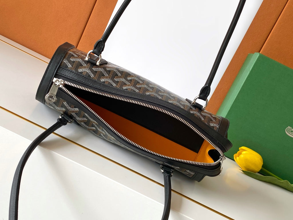 Goyard bag with zipper front pocket, black interior view, and adjustable shoulder strap.