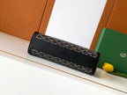 Goyard bag, black monogram front panel with zipper and embossed logo detail.
