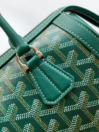 Goyard bag handle, dark green leather strap with stitching over patterned interior