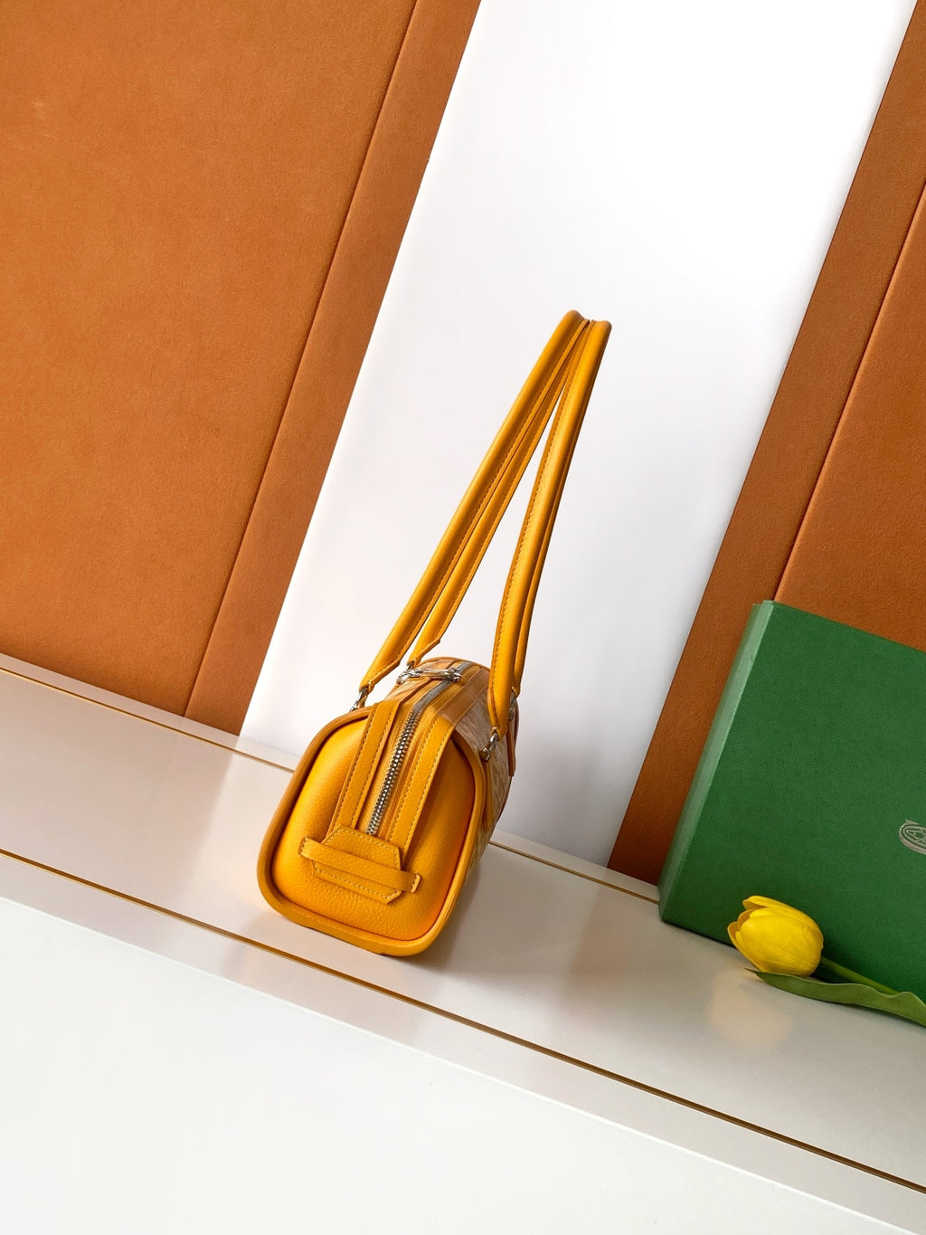 Goyard yellow monogram handbag side view with rolled top handles