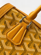 Goyard yellow monogram handbag close-up of front flap pocket and stitching