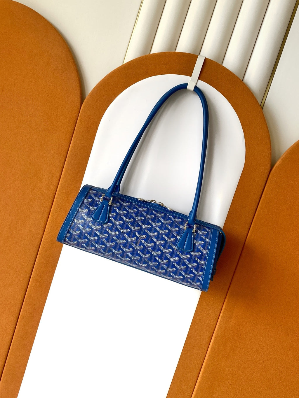 Blue Goyard patterned mini tote bag with two top handles and front clasp