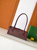Burgundy geometric logo handbag with curved top handle and front strap