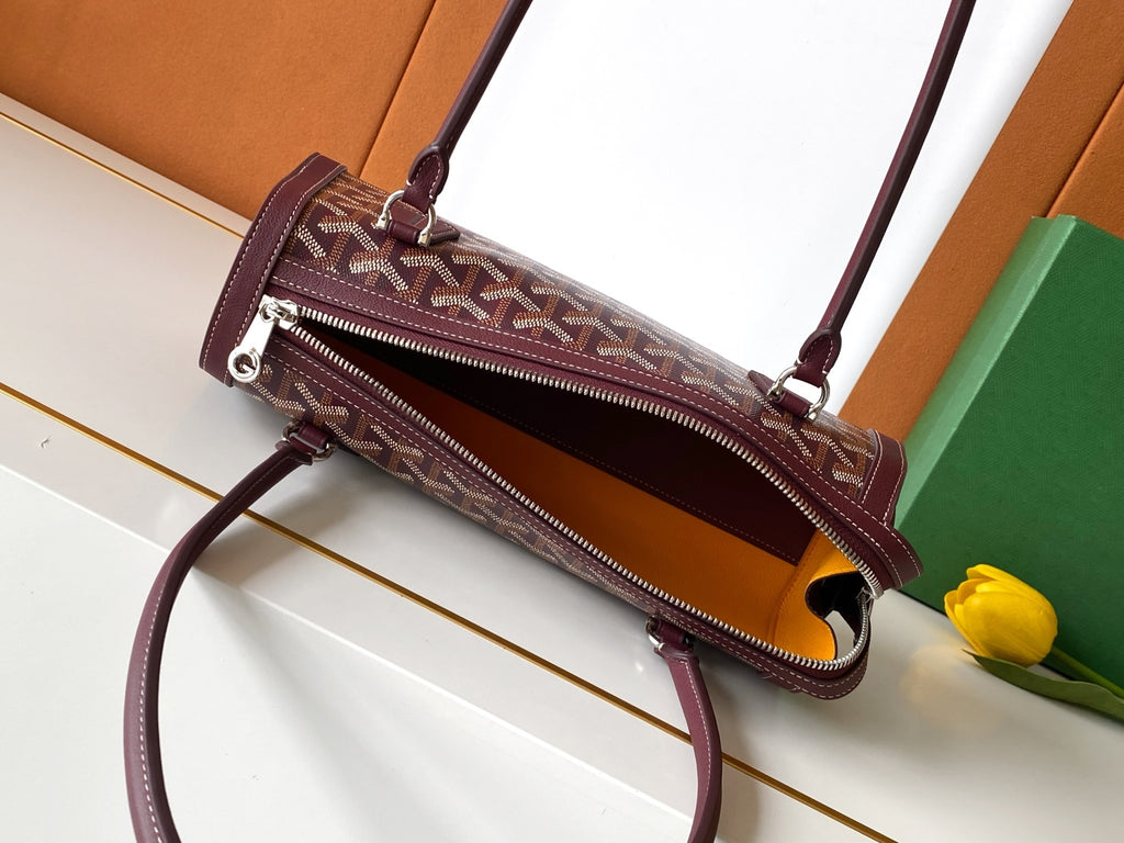 Burgundy logo handbag with crossbody strap and dual zip pockets