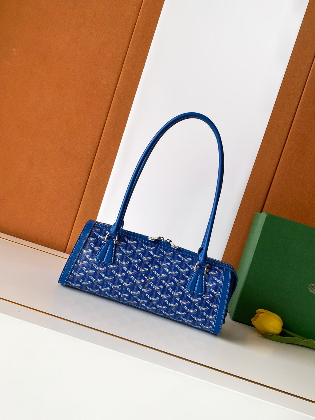 Blue Goyard patterned mini tote bag with top handles and front clasp hardware