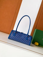 Blue Goyard patterned mini tote bag with top handles and front clasp hardware