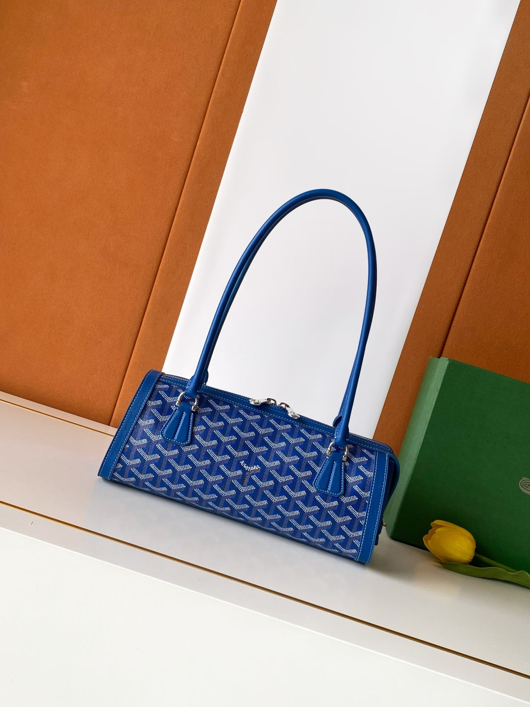 Blue Goyard patterned mini tote bag with top handles and front clasp hardware
