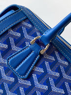 Blue patterned interior with zip pocket, stitched trim, and leather tab