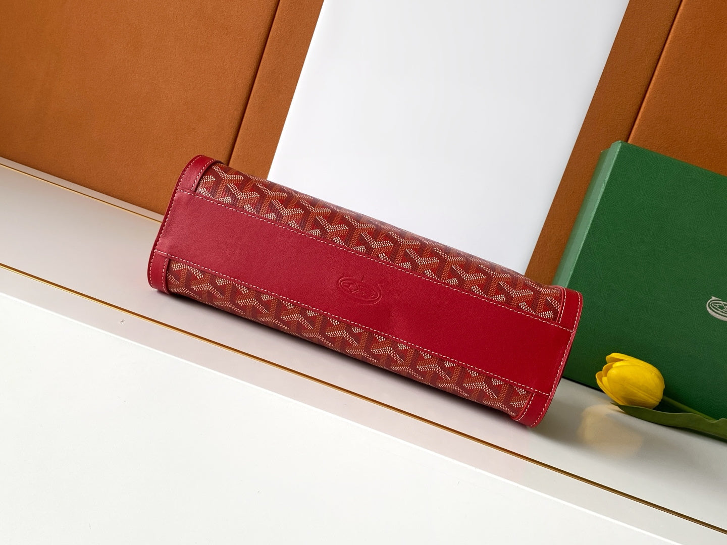 Red long slim zip-top bag with top handle and patterned front panel