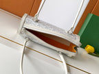 Goyard white bag with front zipper opening and leather trim