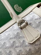 Goyard white strap attachment with metal clasp on patterned canvas