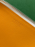 Goyard yellow leather lining with zipper track and embossed logo