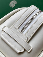 Goyard white leather bag close-up with zipper teeth and stitched seams
