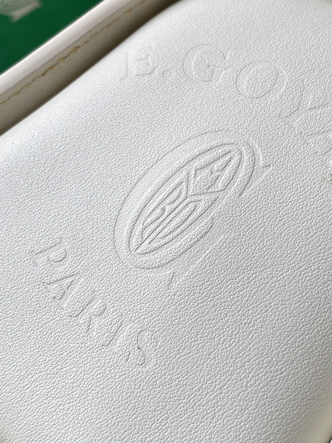 Goyard white leather panel with embossed logo stamp