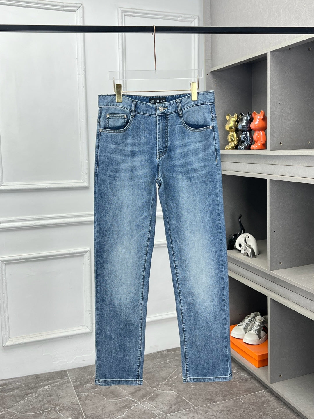 Versace light blue denim jeans, five-pocket style with stitched detailing