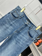 Versace denim jeans waistband with belt loops and metal logo button