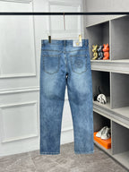 Versace light blue denim jeans with belt loops and front pocket stitching