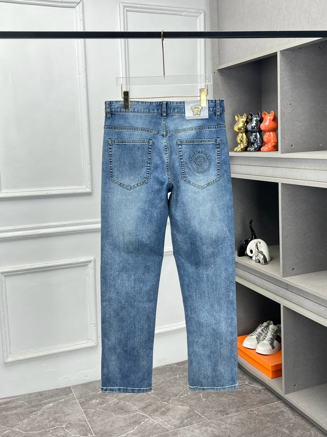 Versace light blue denim jeans with belt loops and front pocket stitching