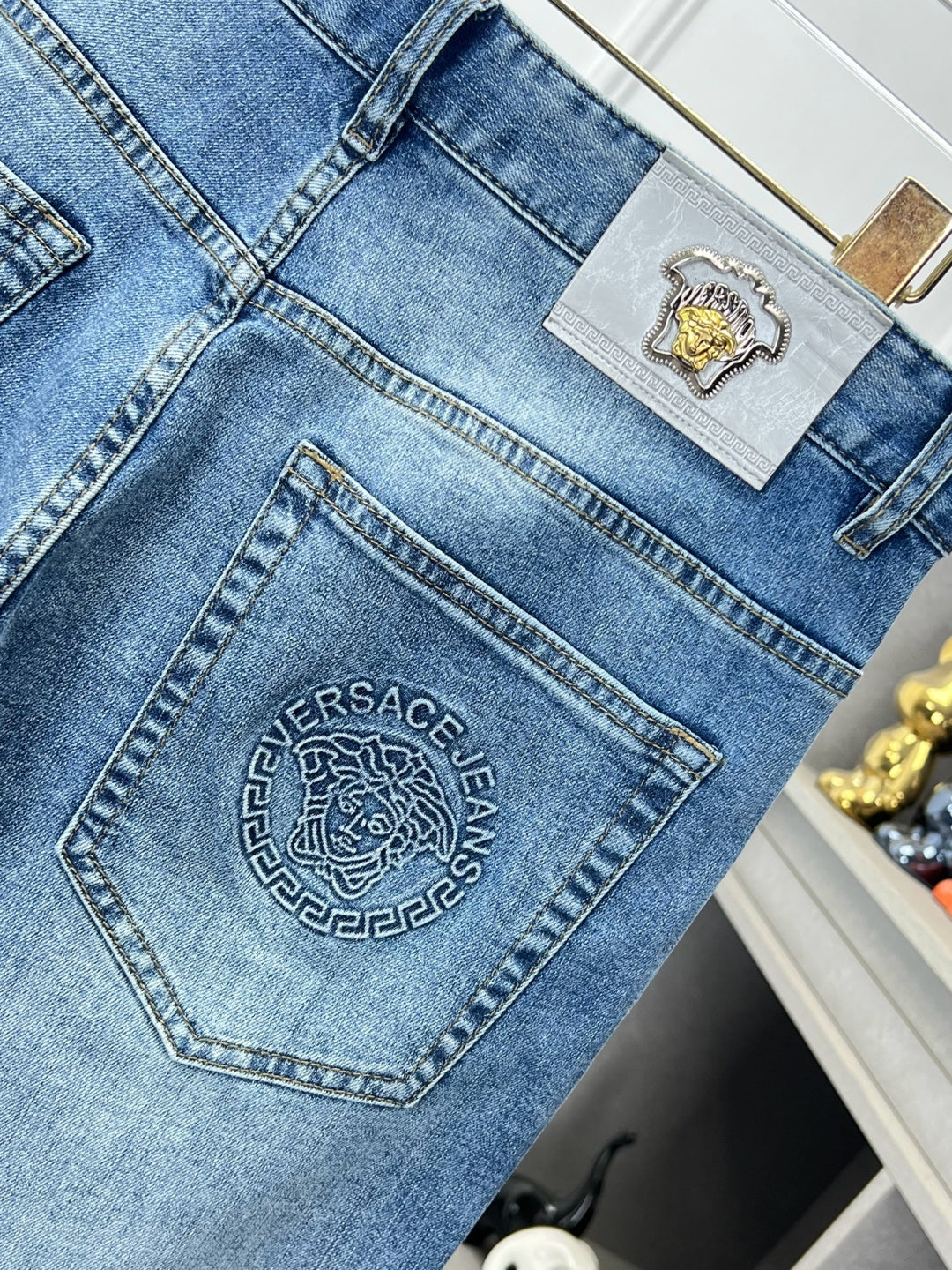 Versace denim jeans back pocket with oval logo embroidery patch