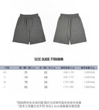 Size guide chart for gray drawstring shorts with XS–L measurements table