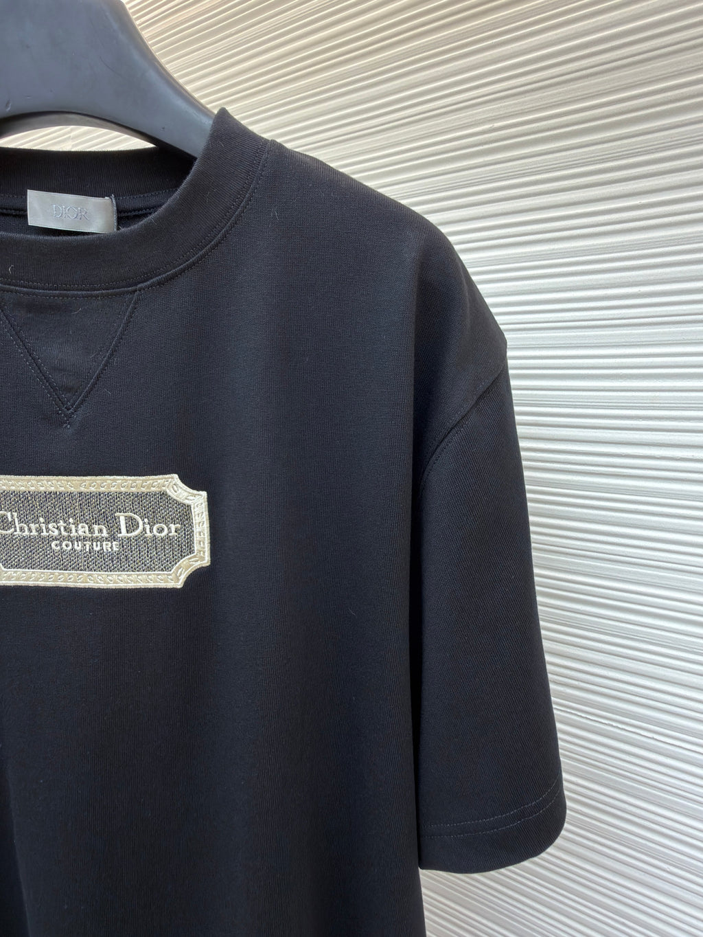 Dark navy T-shirt with Christian Dior couture logo patch on chest