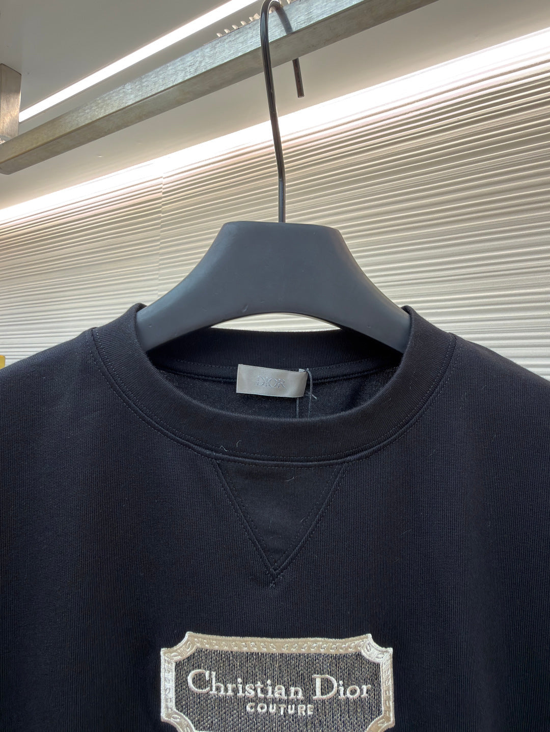 Dark navy T-shirt with crew neck and Christian Dior couture logo label