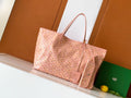 Pink patterned tote bag with leather top handles and open top view