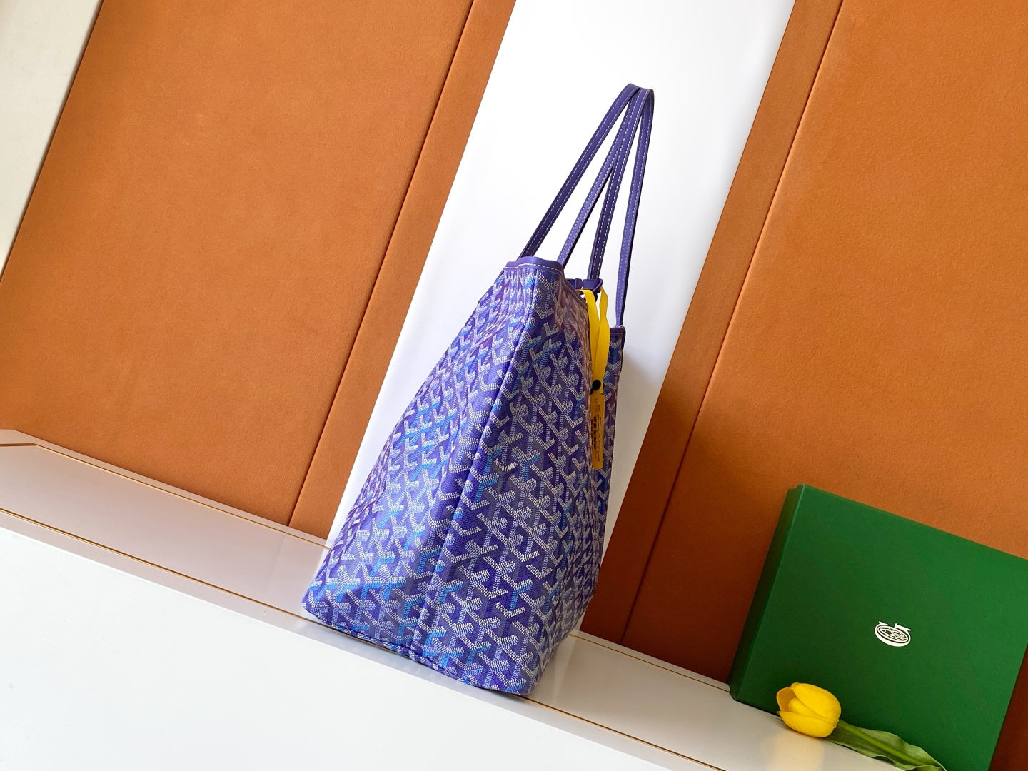 Purple monogram tote bag with top handles and hanging key fob